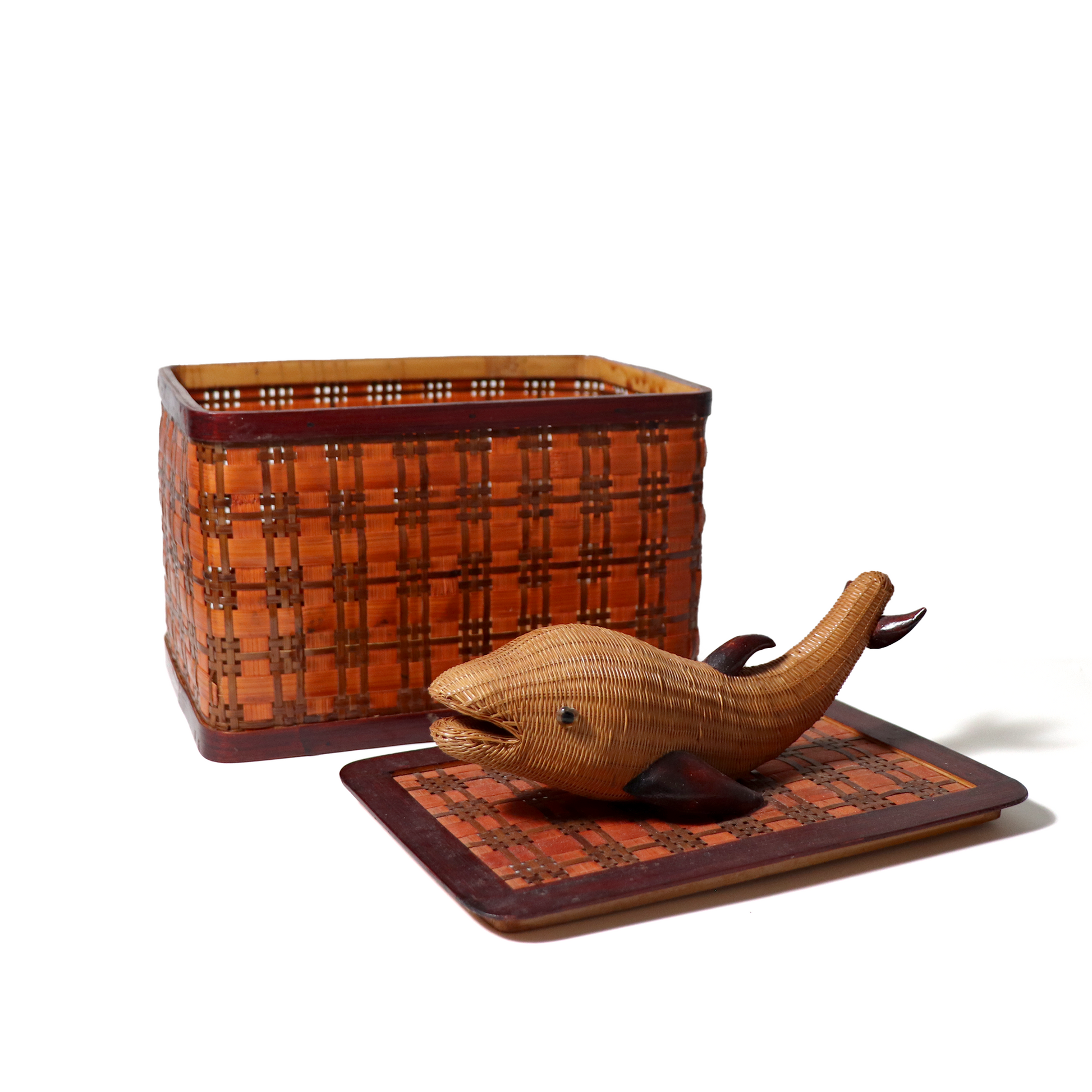 woven wicker dolphin on the lid of the box